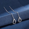 Bohemian Tassel Drop Earrings Detailed view of star and heart beads on wire tassels.