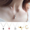 Butterfly Necklace – front view showcasing tassel details and pendant on a model.