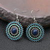 Charm Front profile of circular boho earrings highlighting the colorful enamel details