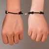 Couple wearing matching bracelets, showcasing unisex design and magnetic hearts emphasizing friendship and shared memories