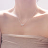 Delicate Silver Bowknot Necklace – handcrafted pendant on an adjustable chain, styled on a model