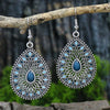 Detailed view of the colorful enamel and hollow leaf design