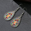 Detailed view of the colorful enamel and hollow leaf design Alternate color option