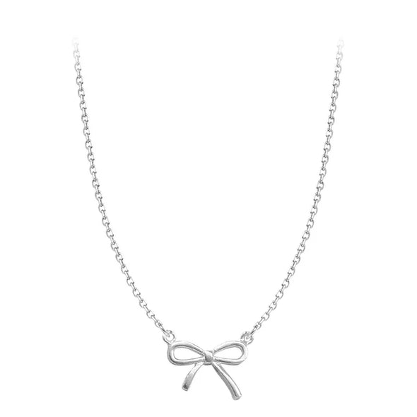 Detailed view of the handmade silver bowknot pendant 
