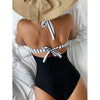 Figure-hugging mesh one-piece in motion  