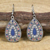 Front profile of boho earrings highlighting the colorful enamel details