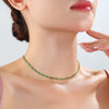 Green CZ Tennis Chain Necklace – vibrant stones on a gold-plated chain, styled on a model.