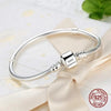 Hands crafting the snake bone bracelet – emphasizing handmade quality.