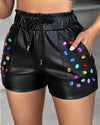 Model wearing PU leather rhinestone shorts