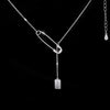 Silver Rectangle Pendant Necklace – minimalist pendant on a delicate chain, styled on a model