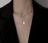 Silver Rectangle Pendant Necklace – minimalist pendant on a delicate chain, styled on a model