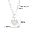 Sun Pendant Heart Necklace – sunburst and heart charms on a stainless steel