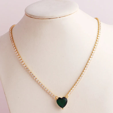 Tennis Chain Necklace – vibrant stones on a gold-plated chain, styled on a model