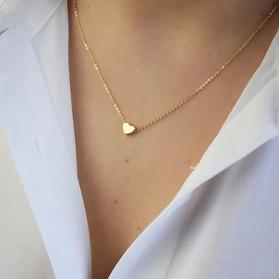 Tiny Heart LOVE Clavicle Necklace – delicate gold chain with heart pendant on a model