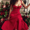 Model seated elegantly, showcasing flowy dress