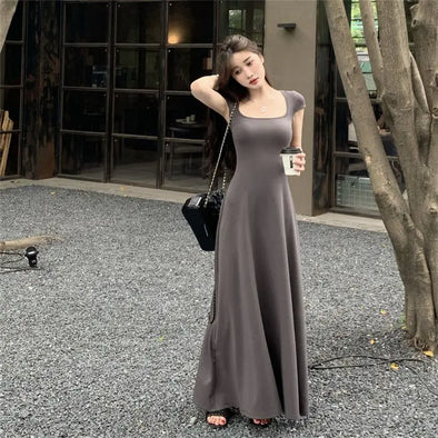 Woman wearing cap sleeve square neck A-line maxi dress front view 