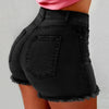  Woman wearing ripped high-waist denim shorts