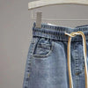 front view of denim skirt with tie waist  -showing pocket and waistband details 