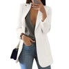 Office-ready oversized women’s white blazer styled with trousers 