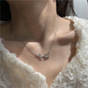 leaf Necklace – front view showcasing tassel details and pendant on a model.