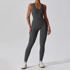 Model in volcanic ash e jumpsuit, showcasing 4-way stretch fabric