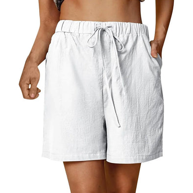 Model wearing white  cotton linen shorts outdoors
