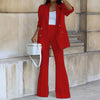 Model wearing two-piece red solid blazer pants suit